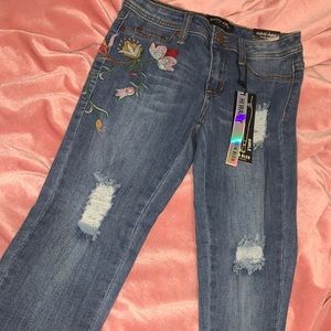 Denim jeans with knitted designs
